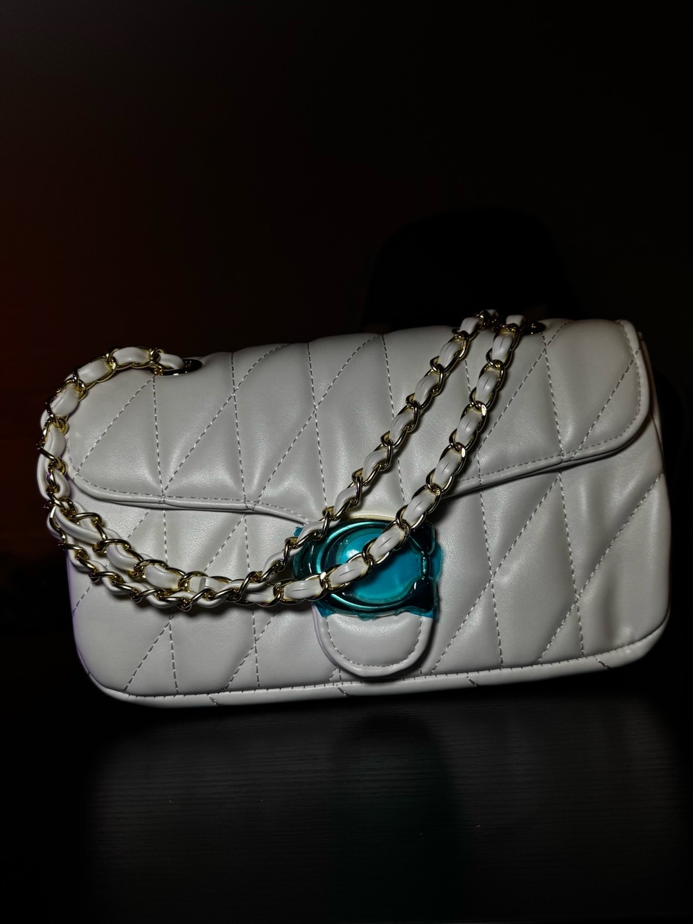 Quilted White Shoulder Bag with Gold Chain and Teal Accent